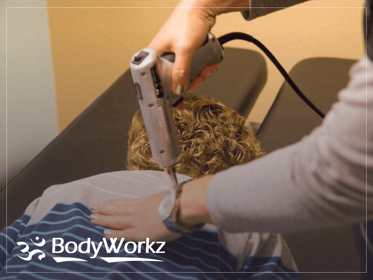 Dr. Wallace administering spinal treatment to chiropractic patient in Mesa, Arizona